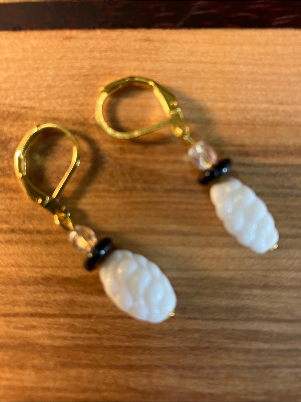 Gold Leverback Earrings with White Carved Beads and Black Accents